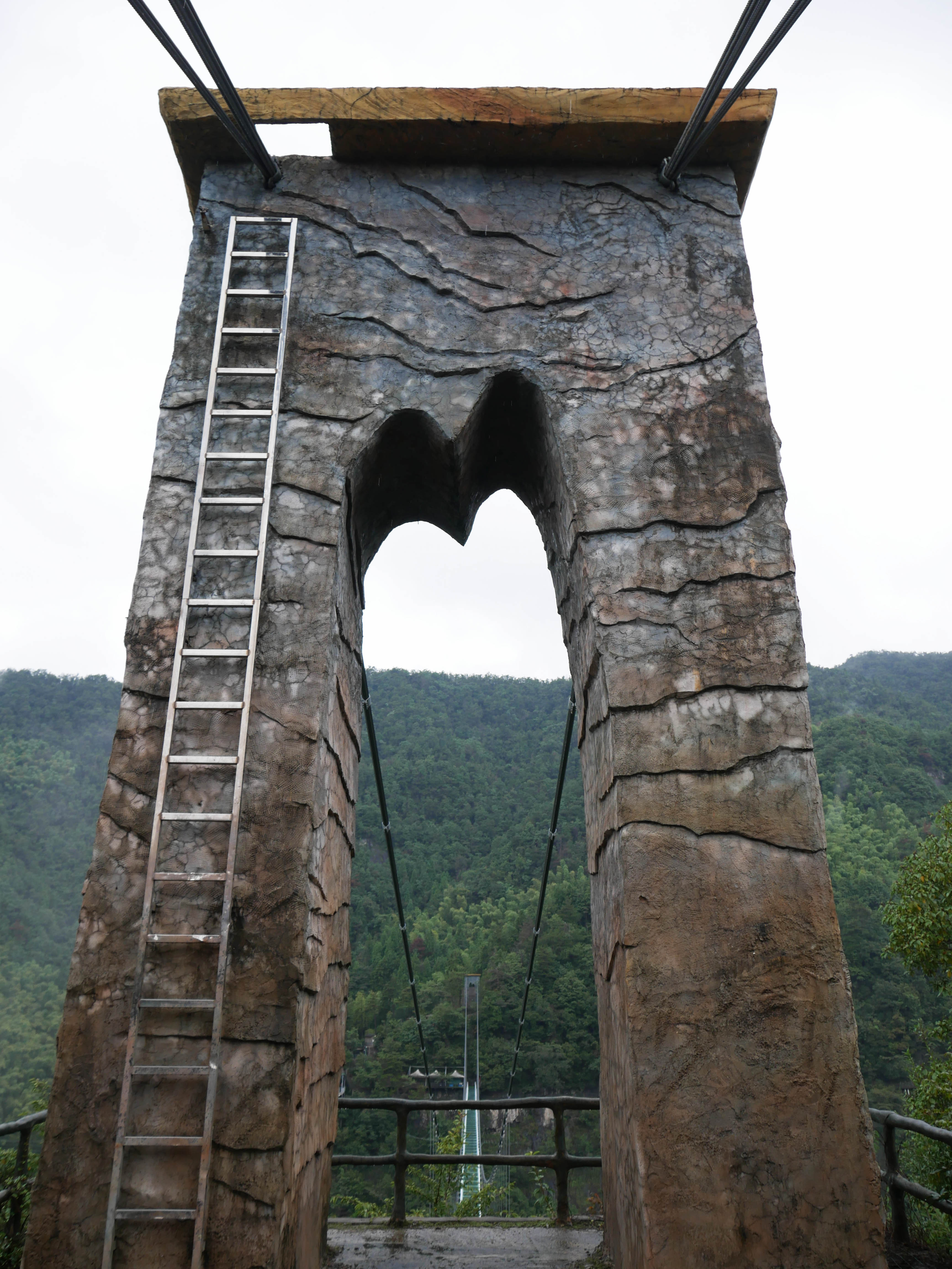 LingjiangyuanGlassFootbridgeTowerStone2.JPG