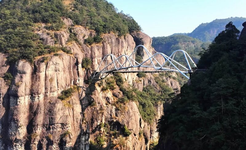 File:Wolong FootbridgeCliffSun.jpg