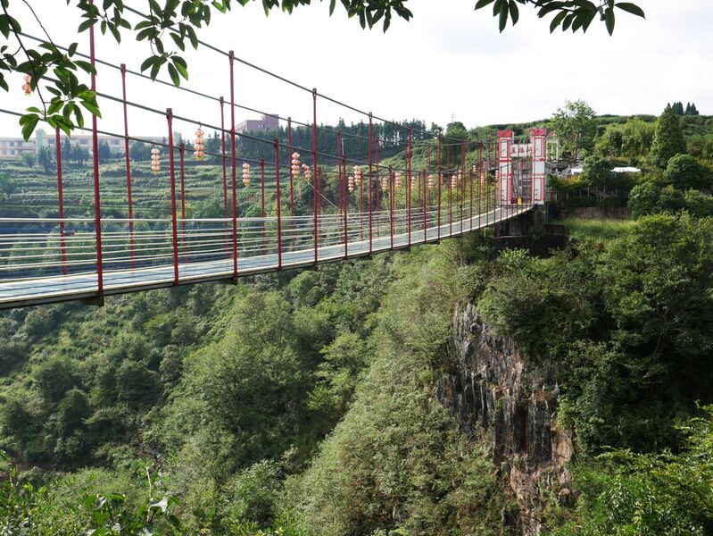 File:WulongGorgeFootbridgeTreesSky.JPG
